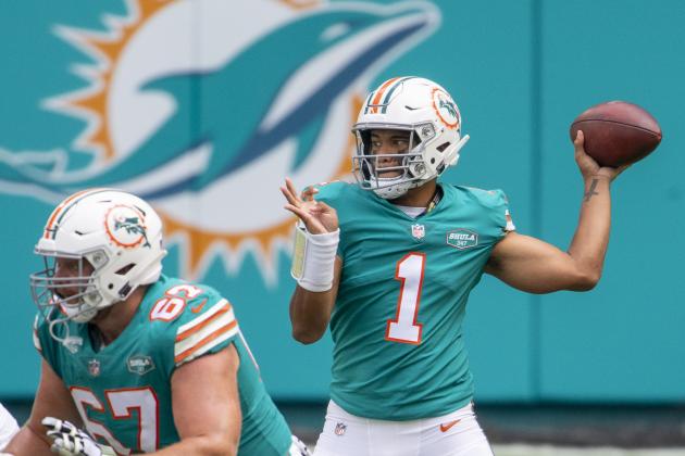 Miami Dolphins quarterback Tua Tagovailoa (1) throws the ball against the New England Patriots as Miami Dolphins guard Ted Karras (67) blocks during an NFL football game, Sunday, Dec. 20, 2020, in Miami Gardens, Fla. (AP Photo/Doug Murray)