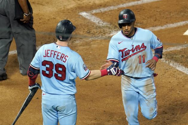 Minnesota Twins' Jorge Polanco, right, is greeted by Ryan Jeffers after Polanco scored on a single by Marwin Gonzalez off Detroit Tigers pitcher Casey Mize during the third inning of a baseball game, Wednesday, Sept. 23, 2020, in Minneapolis. (AP Photo/Jim Mone)
