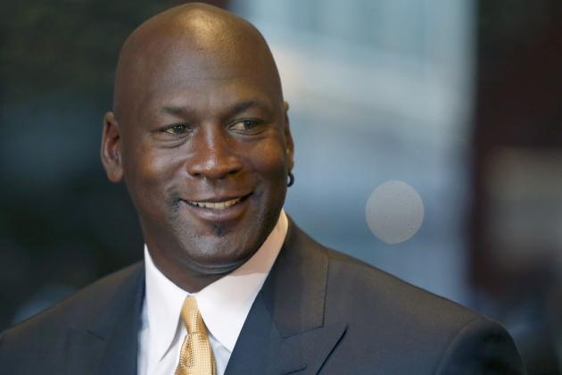 FILE - In this Aug. 21, 2015, file photo, former NBA star Michael Jordan smiles at reporters in Chicago. Nike is opening a Michael Jordan-only store in Chicago's Loop on Saturday, Oct. 24, 2015. The new Jordan Brand store will sell merchandise with the trademarked Michael Jordan