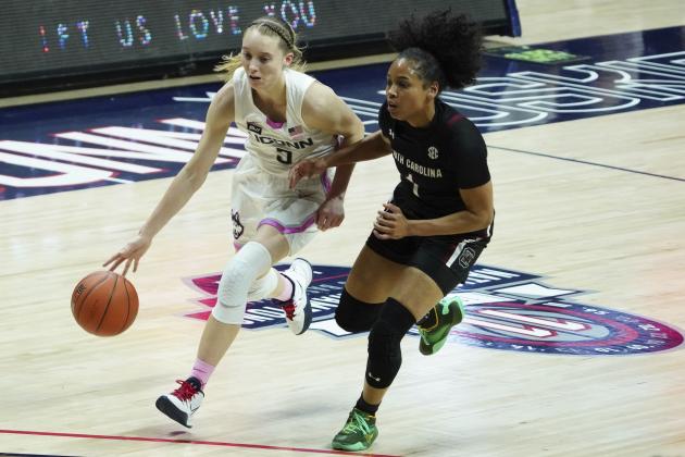Connecticut guard Paige Bueckers (5) drives the ball against South Carolina guard Zia Cooke (1) in the first half of an NCAA college basketball game in Storrs, Conn., Monday, Feb. 8, 2021. (David Butler/Pool Photo via AP) Connecticut guard Paige Bueckers (5) drives the ball against South Carolina guard Zia Cooke (1) in the first half of an NCAA college basketball game in Storrs, Conn., Monday, Feb. 8, 2021. (David Butler/Pool Photo via AP)