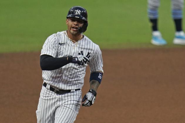 New York Yankees' Gleyber Torres reacts as he rounds the bases after hitting a two-run home run to score Brett Gardner during the sixth inning in Game 4 of a baseball American League Division Series against the Tampa Bay Rays, Thursday, Oct. 8, 2020, in San Diego. (AP Photo/Gregory Bull)