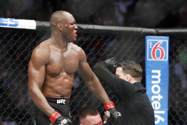 Kamaru Usman stands up after defeating Colby Covington in a mixed martial arts welterweight championship bout at UFC 245, Saturday, Dec. 14, 2019, in Las Vegas. (AP Photo/John Locher)