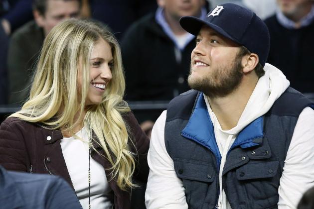 FILE - In this Nov. 17, 2015, file photo, Detroit Lions quarterback Matthew Stafford and his wife Kelly smile while watching the Detroit Pistons play the Cleveland Cavaliers during an NBA basketball game, in Auburn Hills, Mich. Matthew is juggling his job on the field and his role as a husband and father as his wife, Kelly, recovers from surgery to remove a brain tumor. (AP Photo/Duane Burleson, File)