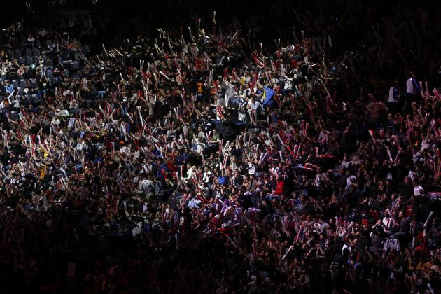 Spectateurs watch the final of League of Legends tournament between Team G2 Esports and Team FunPlus Phoenix, in Paris, Sunday, Nov. 10, 2019. The biggest e-sports event of the year saw a Chinese team, FunPlus Phoenix, crowned as world champions of the video game League of Legends. Thousands of fans packed a Paris arena for the event, which marked another step forward for the growing esports business. (AP Photo/Thibault Camus)
