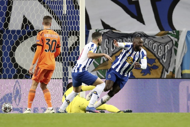 Porto's Moussa Marega, right, celebrates after scoring his side's second goal during the Champions League round of 16, first leg, soccer match between FC Porto and Juventus at the Dragao stadium in Porto, Portugal, Wednesday, Feb. 17, 2021. (AP Photo/Luis Vieira) Porto's Moussa Marega, right, celebrates after scoring his side's second goal during the Champions League round of 16, first leg, soccer match between FC Porto and Juventus at the Dragao stadium in Porto, Portugal, Wednesday, Feb. 17, 2021. (AP Photo/Luis Vieira)