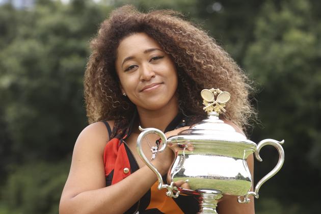 Japan's Naomi Osaka poses with the Daphne Akhurst Memorial Cup during a photo shoot at Government House the day after defeating United States Jennifer Brady in the women's singles final at the Australian Open tennis championship in Melbourne, Australia, Sunday, Feb. 21, 2021.(AP Photo/Hamish Blair)