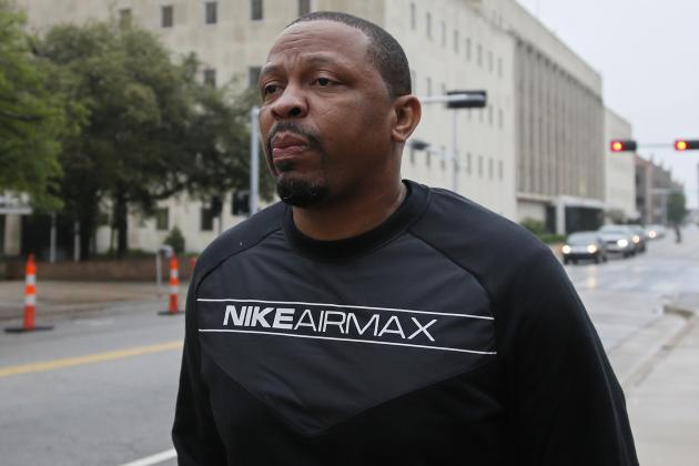 FILE - In this Sept. 27, 2017, file photo, Lamont Evans, an assistant basketball coach at Oklahoma State University, leaves the federal courthouse following a court appearance in Oklahoma City. Evans is scheduled to appear in a New York City courtroom on Thursday, Oct. 12, for his part in a case in which coaches and others are charged with using hundreds of thousands of dollars in bribes to influence the choices star athletes make about schools, sponsors, agents and financial advisers. (AP Photo/Sue Ogrocki, File)