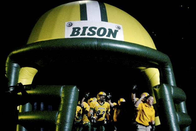 North Dakota State head football coach Chris Klieman leads the Bison onto the field for an of an NCAA college football game against Incarnate Word Saturday, Sept. 13, 2014, at the Fargodome in Fargo, N.D. (AP Photo/Bruce Crummy)