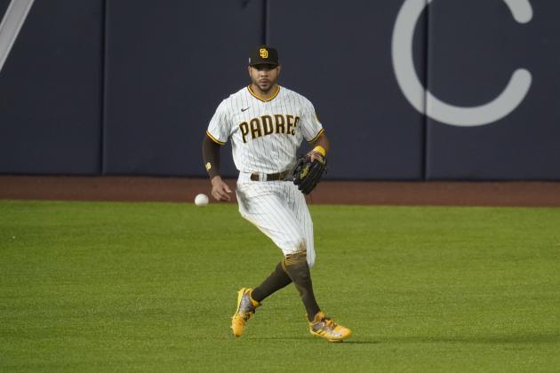 San Diego Padres left fielder Tommy Pham chases down a ball in Game 3 of a baseball National League Division Series against the Los Angeles Dodgers Thursday, Oct. 8, 2020, in Arlington, Texas. (AP Photo/Sue Ogrocki)
