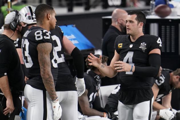 Las Vegas Raiders tight end Darren Waller #83 and quarterback Derek Carr #4 talk on the sideline during the first quarter of an NFL football game against the Miami Dolphins, Saturday, Dec. 26, 2020, in Las Vegas. (AP Photo/Jeff Bottari)