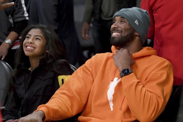 Former Los Angeles Laker Kobe Bryant and his daughter Gianna Bryant attend an NBA basketball game between the Los Angeles Lakers and Dallas Mavericks Sunday, Dec. 29, 2019, in Los Angeles. (AP Photo/Michael Owen Baker)