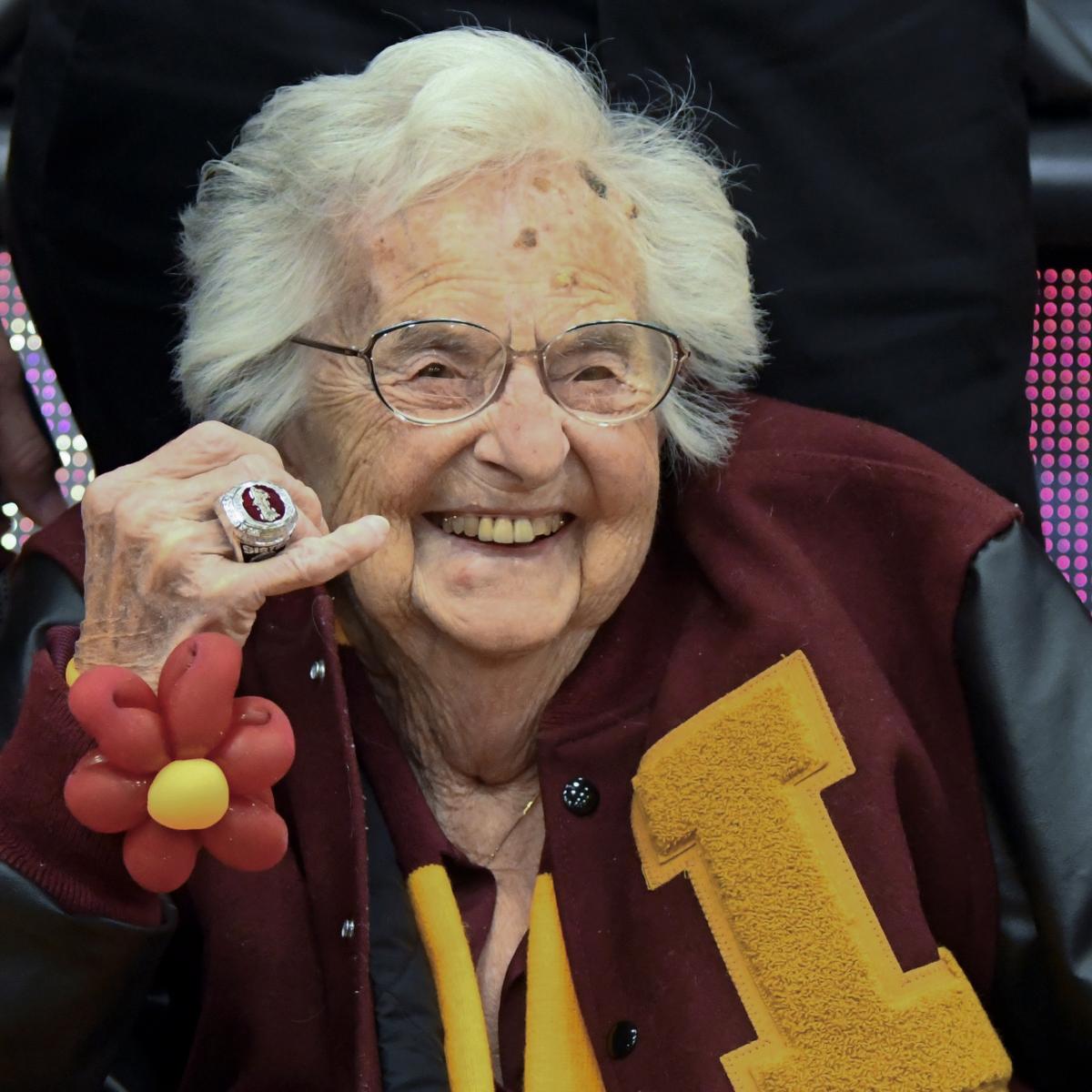 Loyola Chicago Chaplain Sister Jean Takes Picture with Butler Mascot Blue