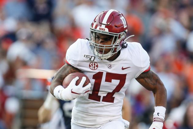 Alabama wide receiver Jaylen Waddle (17) carries the ball against Auburn during an NCAA college football game Saturday, Nov. 30, 2019, in Auburn, Ala. (AP Photo/Butch Dill)