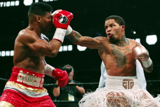 CORRECTS DATE - Gervonta Davis, right, lands a punch on Yuriorkis Gamboa during round eight for the WBA lightweight boxing bout Sunday, Dec. 29, 2019, in Atlanta. Davis won the title by a 12th round TKO. (AP Photo/Tami Chappell)