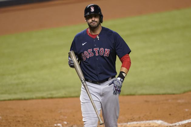 Boston Red Sox's J.D. Martinez reacts after striking out during the fourth inning of a baseball game against the Miami Marlins, Tuesday, Sept. 15, 2020, in Miami. (AP Photo/Lynne Sladky)