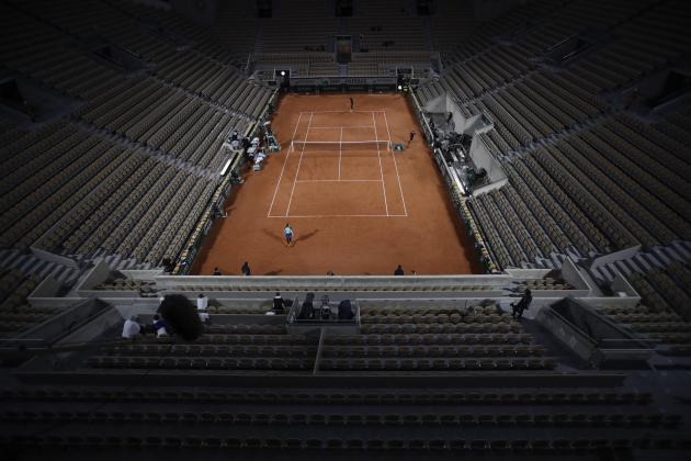 Empty seats of Suzanne Lenglen court are seen as Cori Gauff of the U.S., rear, plays against Britain's Johanna Konta in the first round match of the French Open tennis tournament at the Roland Garros stadium in Paris, France, Sunday, Sept. 27, 2020. (AP Photo/Alessandra Tarantino)