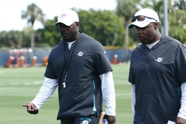 Miami Dolphins head coach Brian Flores and general manager Chris Grier walk off the field after NFL rookie camp practice on Friday, May 10, 2019, in Davie, Fla. (AP Photo/Brynn Anderson)