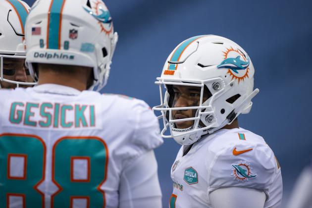 Miami Dolphins quarterback Tua Tagovailoa (1) stands in a huddle during the first quarter of an NFL football game against the Buffalo Bills, Sunday, Jan. 3, 2021, in Orchard Park, N.Y. (AP Photo/Brett Carlsen)
