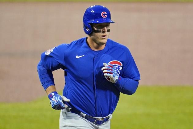 Chicago Cubs' Anthony Rizzo (44) rounds third after hitting a solo home run off Pittsburgh Pirates starting pitcher Trevor Williams, bottom, during the first inning of a baseball game in Pittsburgh, Wednesday, Sept. 23, 2020. (AP Photo/Gene J. Puskar)