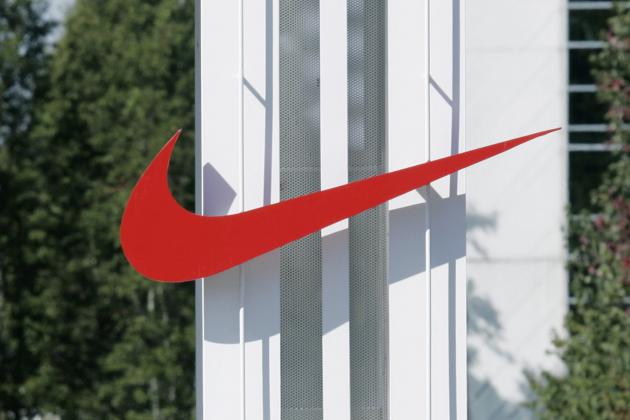 FILE - In this Sept. 29, 2006 file photo, the red Nike swoosh marks the entrance to the company's headquarters campus in Beaverton, Ore. Nike wants to expand its Oregon operations and hire as many as 12,000 new workers by 2020 but wants the government to promise it won't change the state tax code. Oregon Gov. John Kitzhaber says he'll call the Legislature into session Friday to create a law to give Nike its promise. (AP Photo/Don Ryan, File)