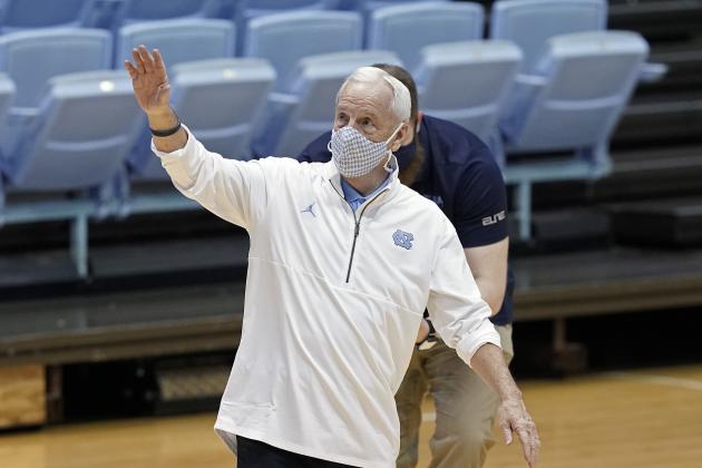 North Carolina head coach Roy Williams waves after being presented with a framed jersey commemorating Williams' 900th career win following an NCAA college basketball game against Florida State in Chapel Hill, N.C., Saturday, Feb. 27, 2021. (AP Photo/Gerry Broome) North Carolina head coach Roy Williams waves after being presented with a framed jersey commemorating Williams' 900th career win following an NCAA college basketball game against Florida State in Chapel Hill, N.C., Saturday, Feb. 27, 2021. (AP Photo/Gerry Broome)