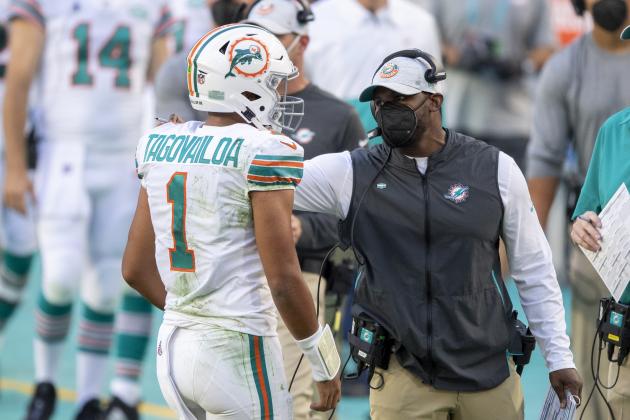 FILE - Miami Dolphins head coach Brian Flores talks to quarterback Tua Tagovailoa (1) on the sidelines as the Dolphins play against the Los Angeles Chargers during an NFL football game in Miami Gardens, Fla., in this Sunday, Nov. 15, 2020, file photo. The San Francisco 49ers have made a big move to grab their quarterback of the future by trading up with Miami for the No. 3 pick in next month's draft. For the Dolphins, the trade signals they’re not in the market for another potential franchise quarterback, and will stake their future on Tua Tagovailoa. (AP Photo/Doug Murray, File)