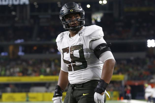FILE - In this Aug. 31, 2019, file photo, Oregon offensive lineman Penei Sewell (58) looks on as Oregon plays Auburn in an NCAA college football game, in Arlington, Texas. Sewell was selected to The Associated Press All-Pac 12 Conference team, and tied for Offensive Player of the Year with Utah quarterback Tyler Huntley and Utah running back Zack Moss, Thursday, Dec. 12, 2019. (AP Photo/Ron Jenkins, File)