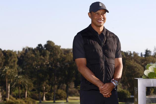 Tiger Woods smiles during the trophy ceremony on the practice green after the final round of the Genesis Invitational golf tournament at Riviera Country Club, Sunday, Feb. 21, 2021, in the Pacific Palisades area of Los Angeles. (AP Photo/Ryan Kang)
