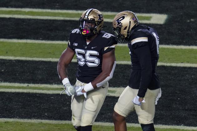 Purdue linebacker Derrick Barnes (55) celebrates a defensive stop with safety Jalen Graham (6) against Northwestern during the first half of an NCAA college football game in West Lafayette, Ind., Saturday, Nov. 14, 2020. (AP Photo/Michael Conroy)