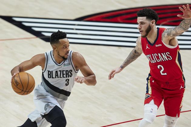 Portland Trail Blazers guard CJ McCollum, left, drives as New Orleans Pelicans guard Lonzo Ball defends during the second half of an NBA basketball game in Portland, Ore., Tuesday, March 16, 2021. (AP Photo/Craig Mitchelldyer)