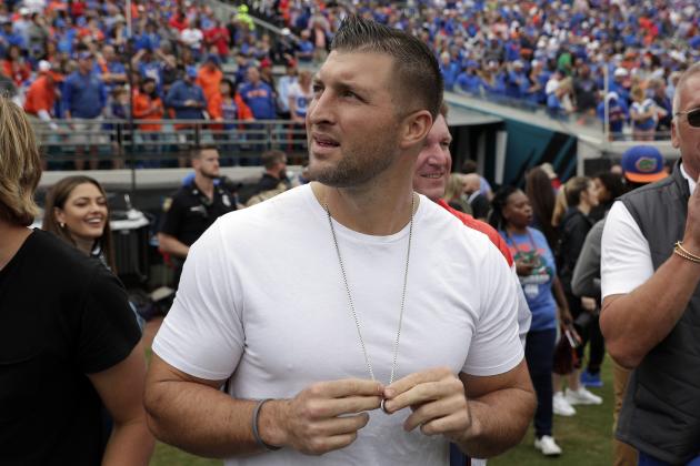 Former Florida quarterback and NFL player Tim Tebow looks up at the scoreboard during the first half of an NCAA college football game between Florida and Georgia, Saturday, Nov. 2, 2019, in Jacksonville, Fla. (AP Photo/John Raoux) Former Florida quarterback and NFL player Tim Tebow looks up at the scoreboard during the first half of an NCAA college football game between Florida and Georgia, Saturday, Nov. 2, 2019, in Jacksonville, Fla. (AP Photo/John Raoux)