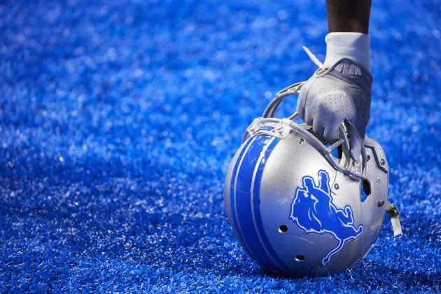 Detroit Lions running back Adrian Peterson (28) rest his hand on his helmet as he takes a knee during an NFL football game against the Tampa Bay Buccaneers, Saturday, Dec. 26, 2020, in Detroit. (AP Photo/Rick Osentoski)