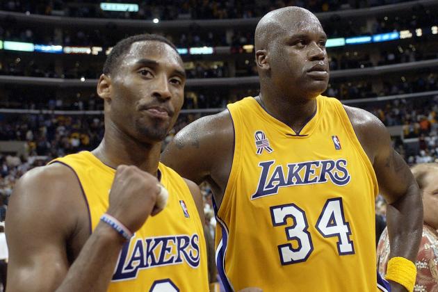 FILE - In this May 4, 2002, file photo, Los Angeles Lakers' Kobe Bryant, left, and Shaquille O'Neal celebrate after winning Game 5 of the Western Conference semifinals against the San Antonio Spurs, in Los Angeles. Bryant downplayed talk of a reignited feud with Shaquille O'Neal, saying there is