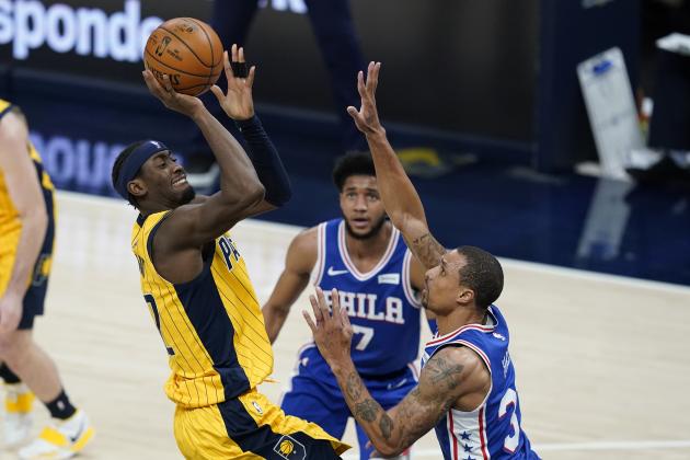 Indiana Pacers' Caris LeVert (22) shoots over Philadelphia 76ers' George Hill (33) during the second half of an NBA basketball game, Tuesday, May 11, 2021, in Indianapolis. (AP Photo/Darron Cummings)