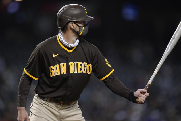 While wearing a face covering, San Diego Padres' Wil Myers steps in the bat against the Arizona Diamondbacks during the eighth inning of a baseball game Wednesday, April 28, 2021, in Phoenix. (AP Photo/Ross D. Franklin)