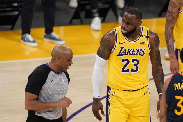 Los Angeles Lakers forward LeBron James, right, right, talks to a referee about a foul call during the first half of an NBA basketball Western Conference Play-In game against the Golden State Warriors Wednesday, May 19, 2021, in Los Angeles. (AP Photo/Mark J. Terrill)