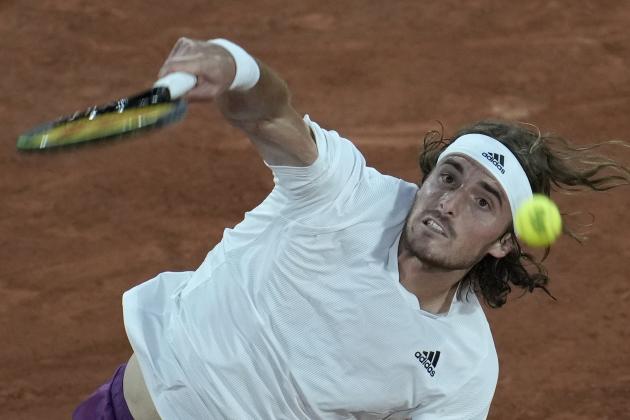 Stefanos Tsitsipas of Greece serves the ball to Jeremy Chardy of France during their first round match of the French Opn tennis tournament at the Roland Garros stadium Sunday, May 30, 2021 in Paris. (AP Photo/Christophe Ena)