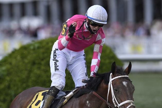 Flavien Prat atop Rombauer, center, reacts after winning the Preakness Stakes horse race at Pimlico Race Course, Saturday, May 15, 2021, in Baltimore. (AP Photo/Nick Wass)