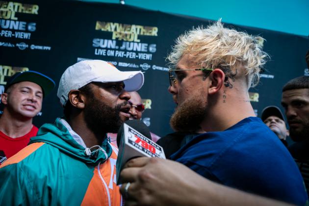 Floyd Mayweather (left) and Logan Paul square off