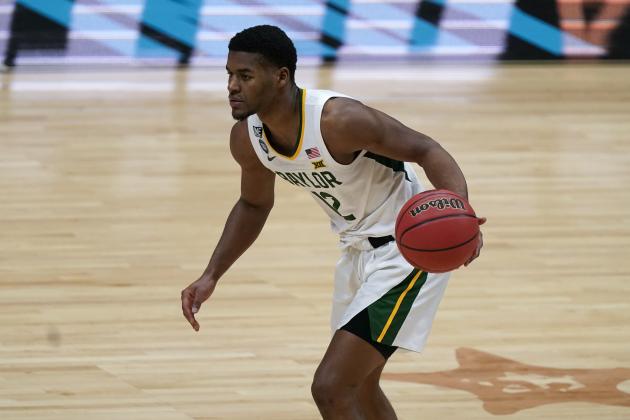 Baylor guard Jared Butler drives up court during the first half of a men's Final Four NCAA college basketball tournament semifinal game against Houston, Saturday, April 3, 2021, at Lucas Oil Stadium in Indianapolis. (AP Photo/Michael Conroy)