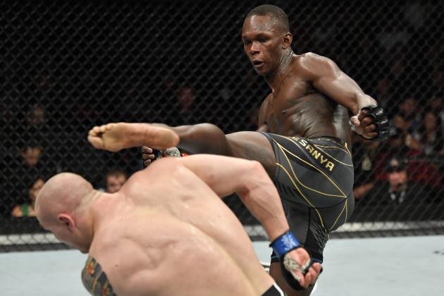 GLENDALE, ARIZONA - JUNE 12: (R-L) Israel Adesanya of Nigeria kicks Marvin Vettori of Italy in their UFC middleweight championship fight during the UFC 263 event at Gila River Arena on June 12, 2021 in Glendale, Arizona. (Photo by Jeff Bottari/Zuffa LLC)