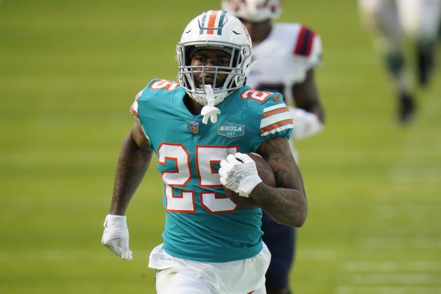 Miami Dolphins cornerback Xavien Howard (25) runs the football during the first half of an NFL football game against the New England Patriots, Sunday, Dec. 20, 2020, in Miami Gardens, Fla. (AP Photo/Chris O'Meara)