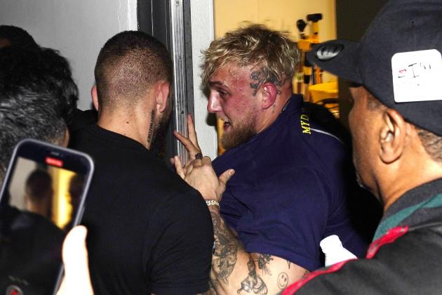 Jake Paul, brother of boxer Logan Paul is pushed into closet to get him away from boxer Floyd Mayweather after a scuffle broke out during a news conference, Thursday, May 6, 2021, in Miami Gardens, Fla. Mayweather, a boxing Hall of Famer, is scheduled to face Logan Paul on June 6 at Hard Rock Stadium in Florida. (AP Photo/Marta Lavandier)