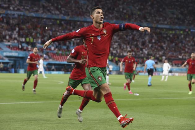 Portugal's Cristiano Ronaldo celebrates after scoring his side's second goal during the Euro 2020 soccer championship group F match between Portugal and France at the Puskas Arena in Budapest, Wednesday, June 23, 2021. (Bernadett Szabo, Pool photo via AP)