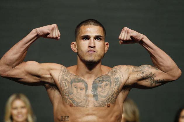 Anthony Pettis poses on the scale during a weigh-in for UFC 197,Friday, April 22, 2016, in Las Vegas. Pettis is scheduled to fight Edson Barboza Saturday in Las Vegas. (AP Photo/John Locher)