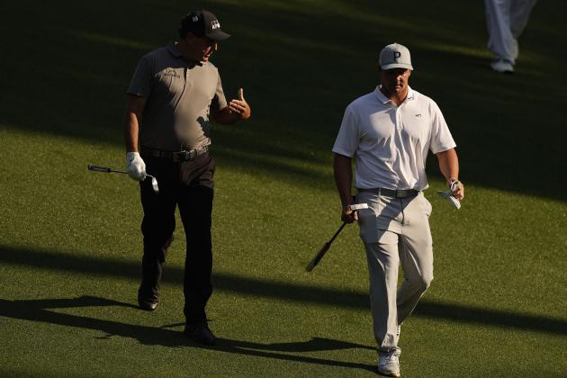 Phil Mickelson speaks with Bryson DeChambeau as they walk down the 10th fairway during a practice round for the Masters golf tournament on Wednesday, April 7, 2021, in Augusta, Ga. (AP Photo/Matt Slocum)