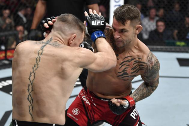 LAS VEGAS, NEVADA - JULY 10: (R-L) Dustin Poirier punches Conor McGregor of Ireland in their welterweight fight during the UFC 264 event at T-Mobile Arena on July 10, 2021 in Las Vegas, Nevada. (Photo by Jeff Bottari/Zuffa LLC)