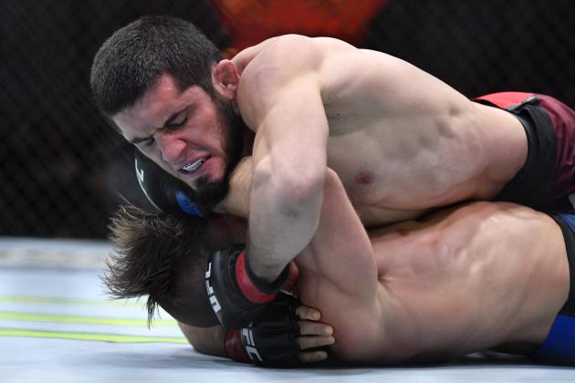 LAS VEGAS, NEVADA - MARCH 06: (R-L) Islam Makhachev punches Drew Dober in their lightweight fight during the UFC 259 event at UFC APEX on March 06, 2021 in Las Vegas, Nevada. (Photo by Chris Unger/Zuffa LLC)