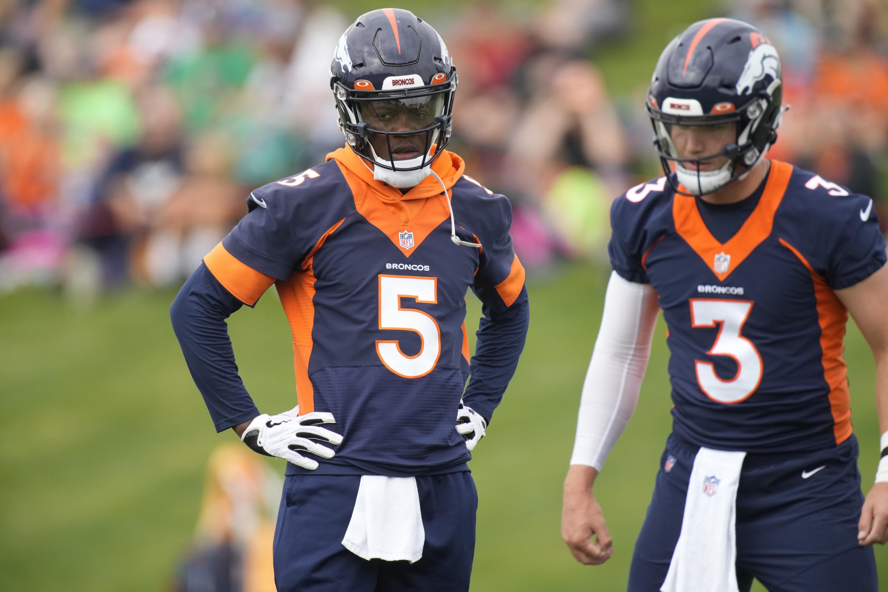 Denver Broncos quarterback Teddy Bridgewater (5) and Denver Broncos  quarterback Drew Lock (3) taking part in drills at an NFL football training  camp at team headquarters Saturday, July 31, 2021, in Englewood