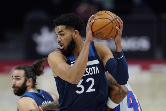 Minnesota Timberwolves center Karl-Anthony Towns grabs a rebound during the first half of an NBA basketball game against the Detroit Pistons, Tuesday, May 11, 2021, in Detroit. (AP Photo/Carlos Osorio)